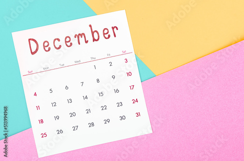 December 2022 calendar on multicolored background.