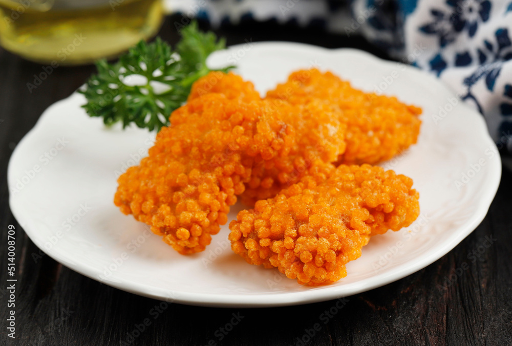 hicken Nugget with Taiwan Crispy Flour, Served on White Plate, on Wooden Table hicken Nugget with Taiwan Crispy Flour, Served on White Plate, on Wooden Table