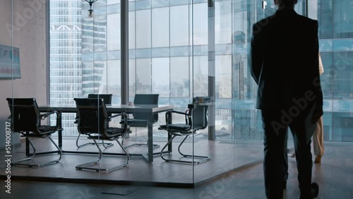 Young business people going to a meeting in boardroom