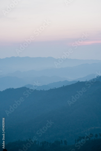 wide view layer of mountain with sunrise background