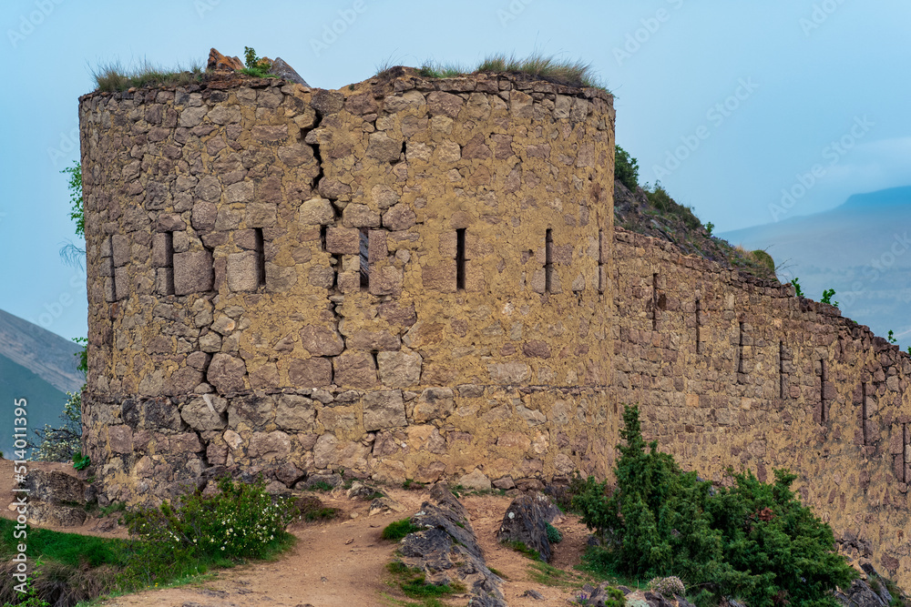 ancient tower on top of a sheer cliff in a mountainous area, Gunib (Shamil) fortress in Dagestan
