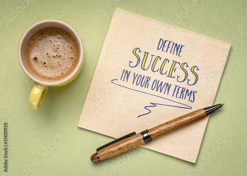 define success in your own terms - inspirational advice, writing on a napkin with a cup of coffee,  business, career, lifestyle and priorities concept