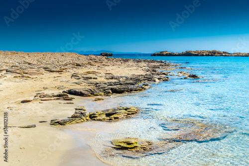Fototapeta Naklejka Na Ścianę i Meble -  Amazing crystal clear water of Manganari beach, Ios Island,  Greece