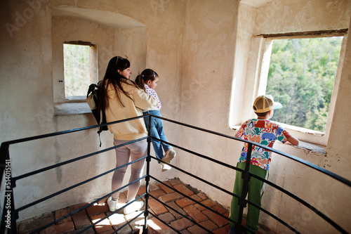 Mother with kids looking from tower in Veveri castle, Czech Republic.