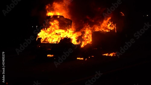 Auto Bursts into flames on freeway photo