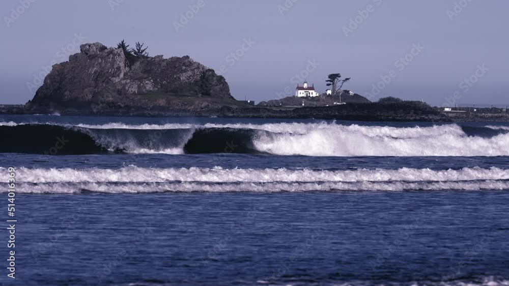 Ocean Waves Rolling in Crashing Near a Lighthouse Ocean Waves Rolling in Crashing Near a Lighthouse