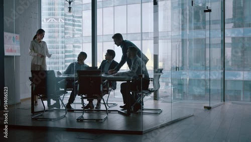 Mature financial analyst telling company development strategy on presentation using computer technology
