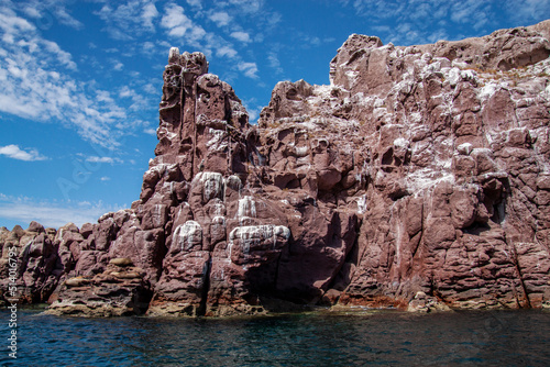 Wild red rock formation in the Pacific ocean in the protected biosphere reserve on Espiritu Santo Island in Baja California Sur, La Paz, Mexico