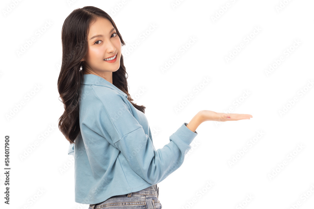 Young asian woman holding copy space imaginary on her palm to insert ad Stand over isolated on white background Portrait happy smiling girl holding copy space on beauty palm hand Looking at camera Young asian woman holding copy space imaginary on her palm to insert ad Stand over isolated on white background Portrait happy smiling girl holding copy space on beauty palm hand Looking at camera