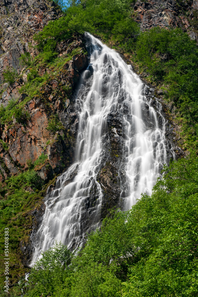 Fototapeta premium Horsetail Falls cascade down the cliffs of Keystone Canyon outside Valdez in Alaska