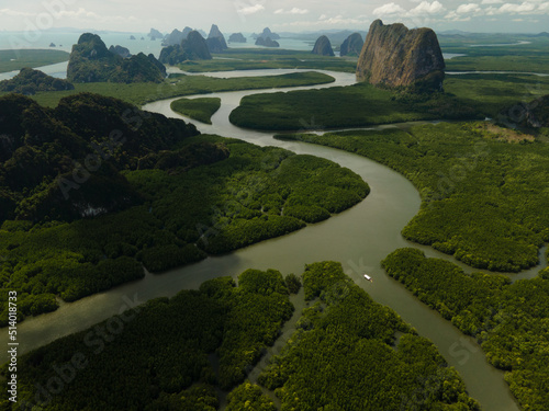 Aerial view of a swerving river through a series of limestones in Phang Nga Bay photo