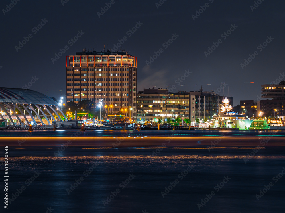 Evening in Amsterdam with skyline and buildings Evening in Amsterdam with skyline and buildings