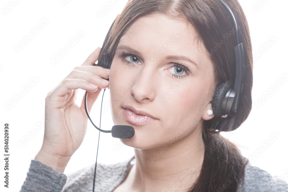 young woman with headset works as a friendly call center agent or at home office young woman with headset works as a friendly call center agent or at home office