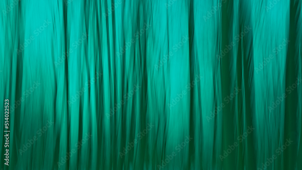 Abstract background blur in tints of green through intentional camera movement along trees Abstract background blur in tints of green through intentional camera movement along trees