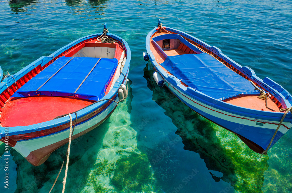 Palermo, Sicily - July 29, 2016: Small port with fishing boats in the center of Mondello