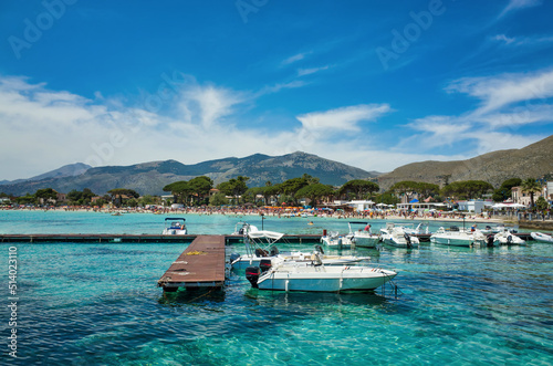 Obraz na płótnie Palermo, Sicily - July 29, 2016: Coast of the sea with a pier and boats. Mediterranean resort in Italy w salonie