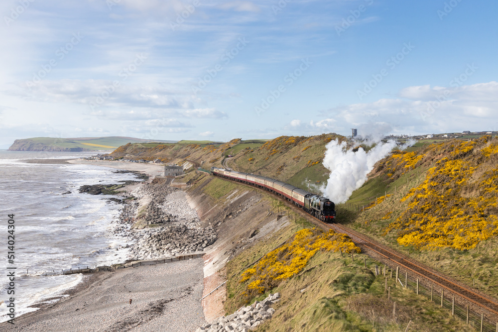 SR West Country No. 34046 'Braunton' works along the Cumbrian coastline at Nethertown with 1Z16 15:30 Carlisle to Rugby 'The Lakelander' on Saturday 9th April 2022. 