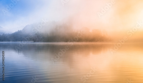 beautiful foggy morning at lake bled with mist and sun. 