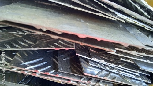 Scrap waste from aluminium plate resulting from the company's production activities. Accommodated and collected in containers