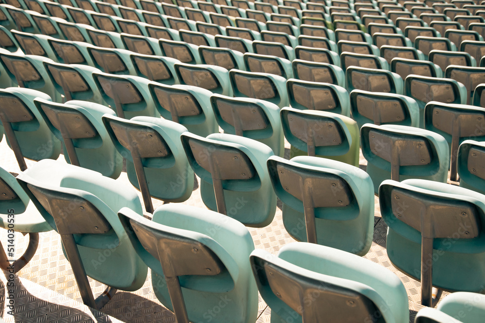 Fototapeta premium Empty Plastic Chairs at the Stadium