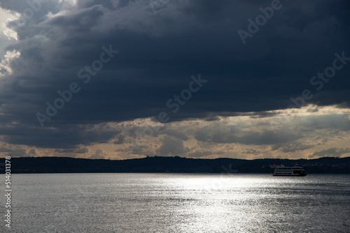 Fototapeta Naklejka Na Ścianę i Meble -  Heavy dark fast moving thunderstorm clouds over lake Constance, Germany