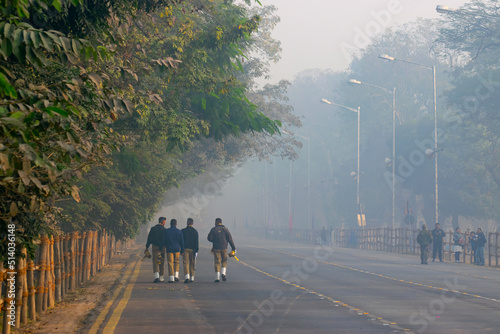 RED ROAD, KOLKATA, WEST BENGAL / INDIA - 21ST JANUARY 2018 : Indian armed force Officers are walking past in the morning. photo