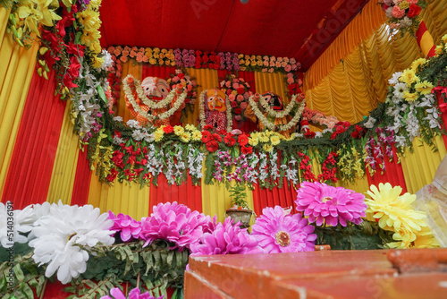 Idol of God Jagannath, Balaram and Suvodra is being worshipped. Ratha jatra festival at Howrah, West Bengal, India. Low angle shot. photo