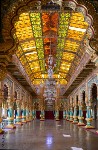 Mysore, Karnataka, India - November 25th 2018 : Beautiful decorated interior ceiling of the Private Durbar Hall, called Diwan-E-Khas, inside the royal Mysore Palace. Gold used on gilded ceiling.