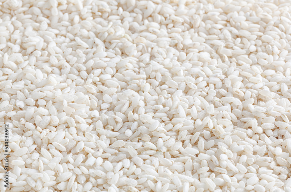 Uncooked arborio rice background Uncooked arborio rice background
