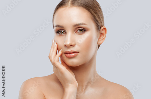 Portrait of attractive girl with healthy clean skin and beautiful make-up. Aesthetic cosmetology and makeup concept.