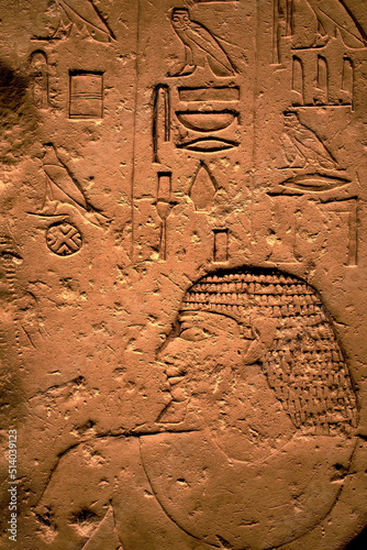 Hieroglyphic carving on an ancient Egyptian sargophagus in an ancient temple, selective focus photo