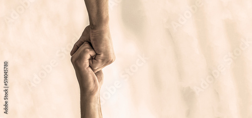 Rescue, helping gesture or hands. Two hands, helping arm of a friend, teamwork. Helping hand outstretched. Friendly handshake, friends greeting, teamwork, friendship photo