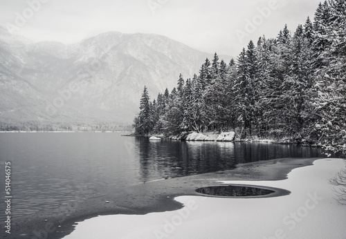 Bohinj lake in winter time with snow and the clouds 