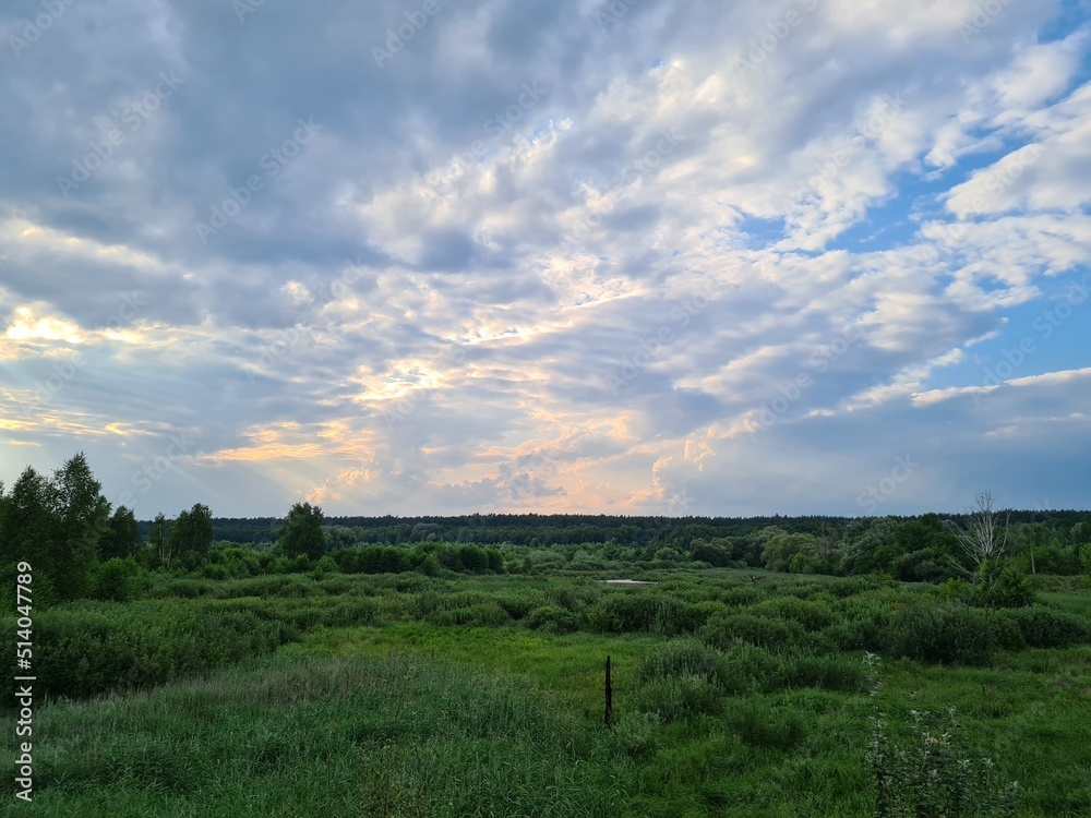 fantastic sunsets over the hills, meadows and forest