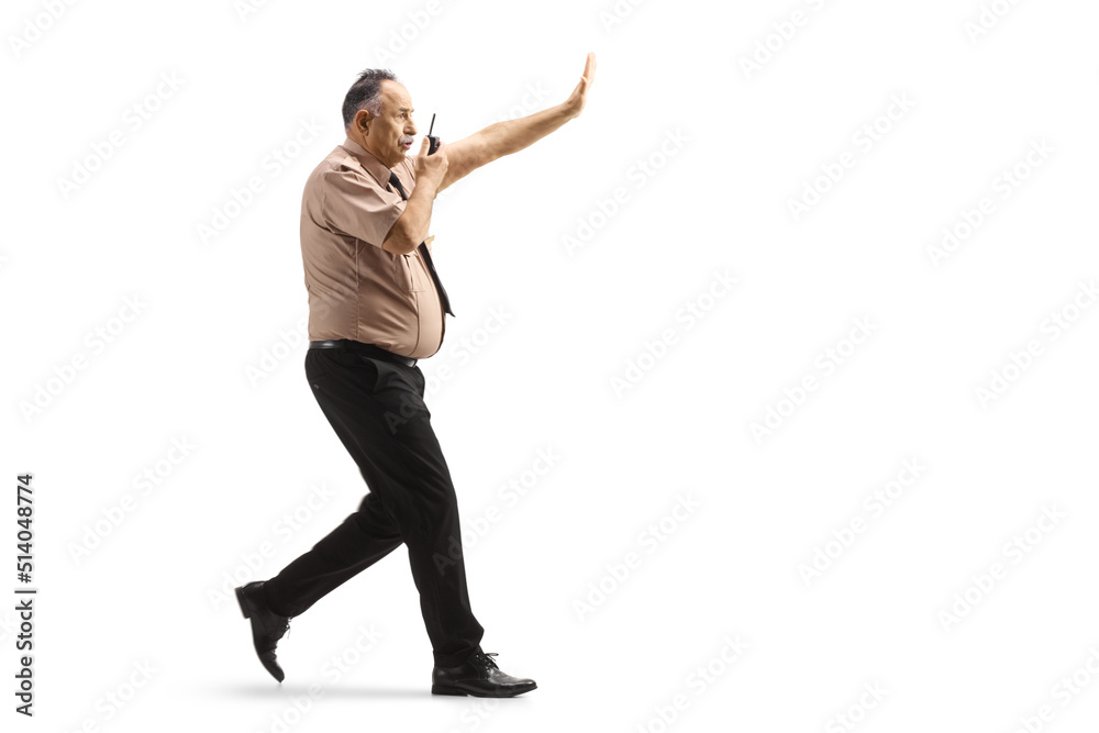 Security officer running with a walkie talkie Security officer running with a walkie talkie