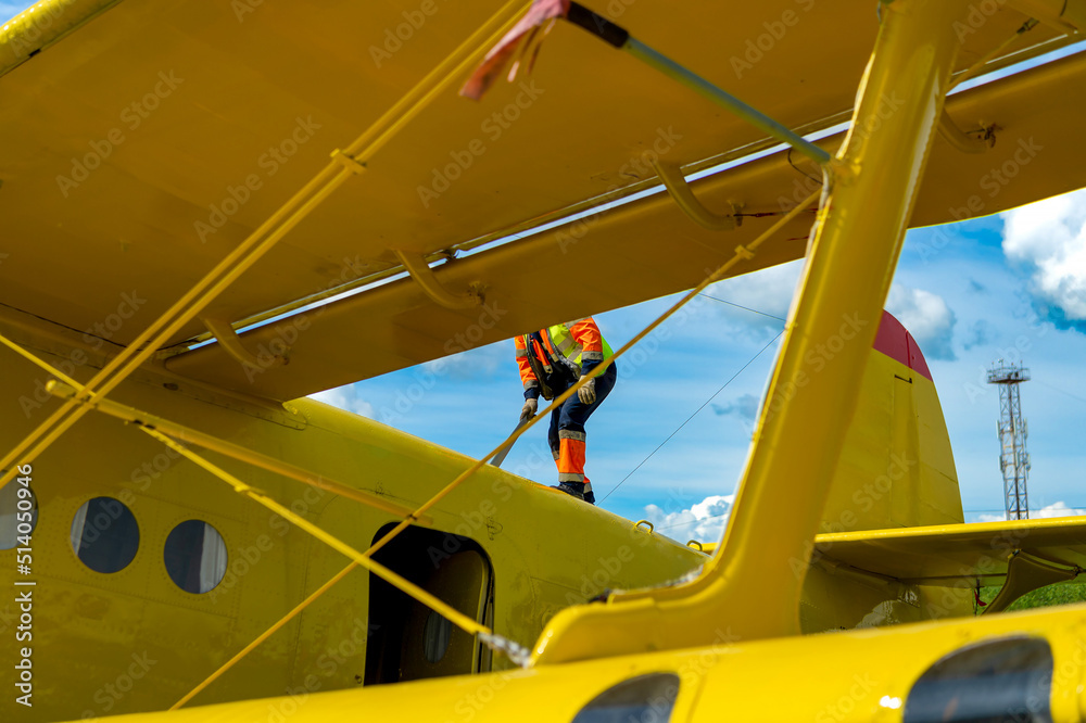 Technician - ground personnel at the airport walks from above the ...
