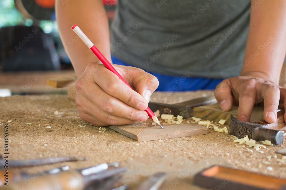craftsman using the pencil marking make on the wooden product working at carpentry workshop furniture project craftsman using the pencil marking make on the wooden product working at carpentry workshop furniture project