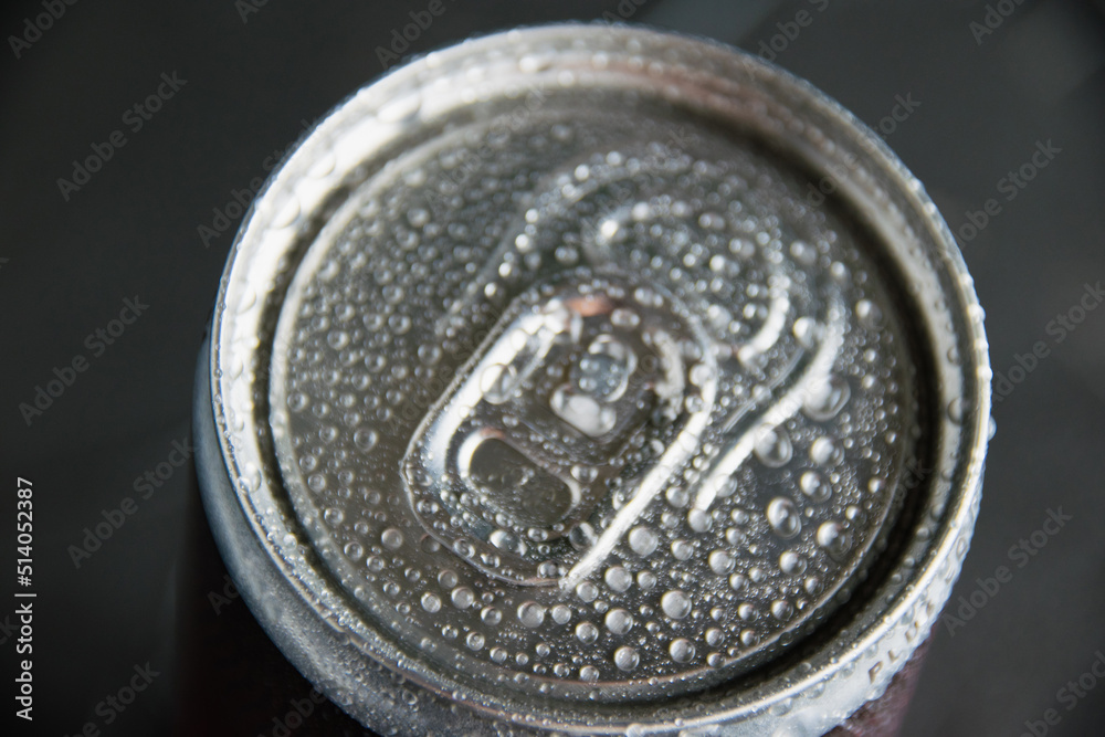 Jar of delicious cold soda drink on a dark background. Feeling cool on a hot summer day