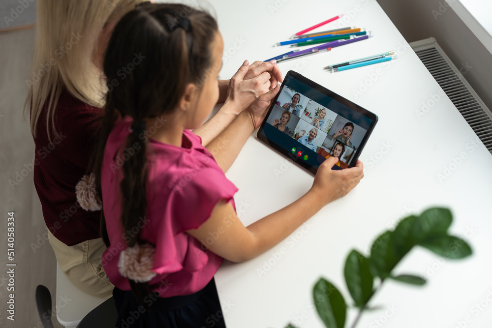 mother and daughter using digital tablet for online chatting from home mother and daughter using digital tablet for online chatting from home