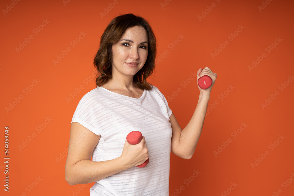 portrait of a positive woman with dumbbells portrait of a positive woman with dumbbells