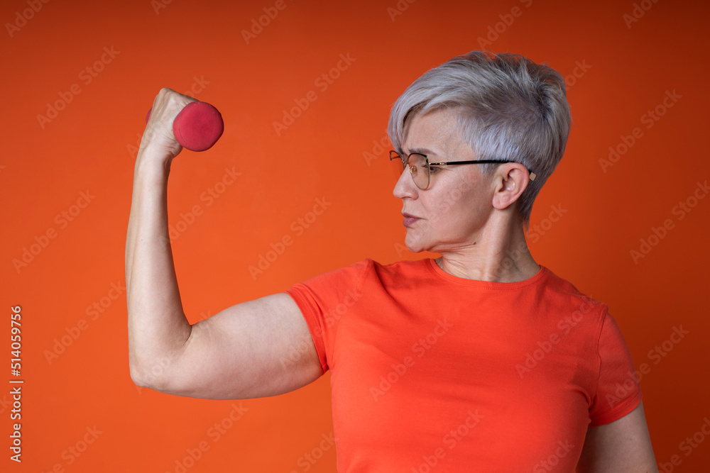 cheerful elderly woman in sportswear with dumbbells cheerful elderly woman in sportswear with dumbbells