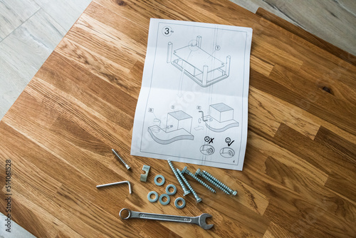 tools and instructions for assembling a wooden table