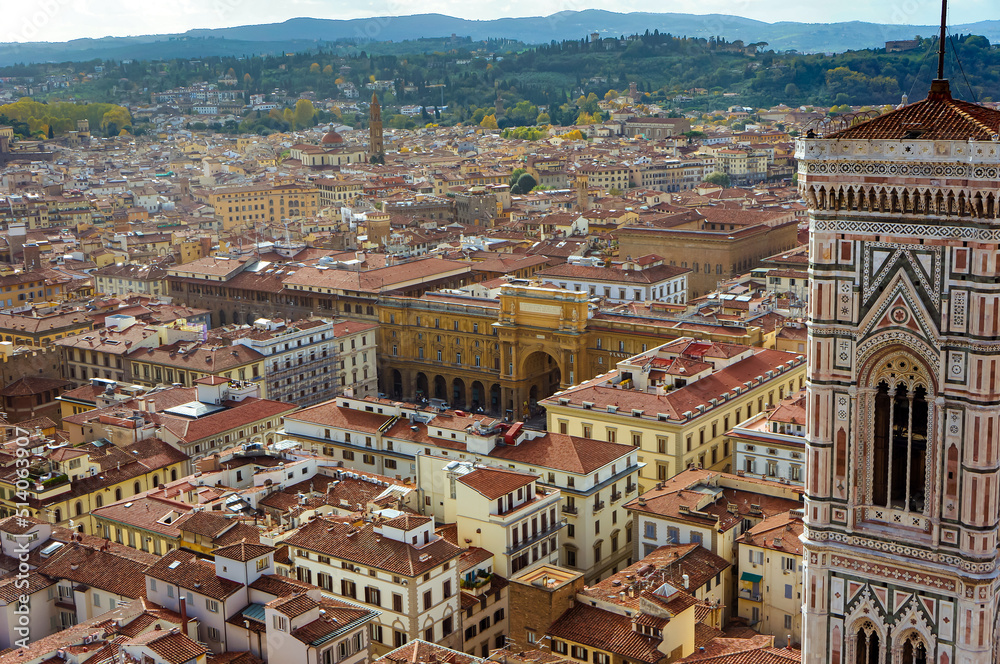 Aerial view of Florence, Italy on a sunny day with beautiful red rooftops of ancient houses and streets. Panoramic view of The Cathedral of Santa Maria del Fiore
