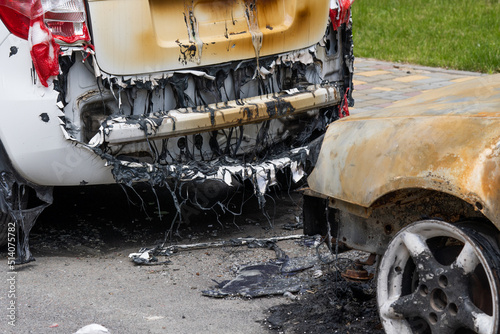 Φωτογραφία arson for revenge. burnt car parked on the street, close-up.