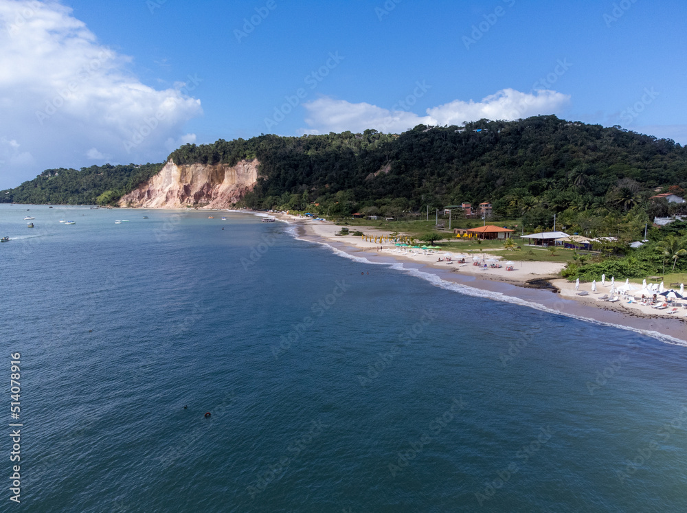 Beautiful orange cliffs with medicinal properties closed with beach in Gamboa, Bahia, Brazil Beautiful orange cliffs with medicinal properties closed with beach in Gamboa, Bahia, Brazil