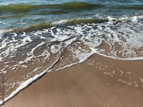 waves on the beach © Jacek