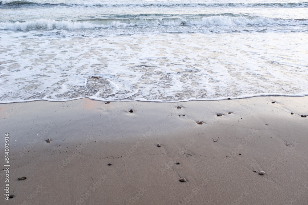 Wave of the sea on the sand beach, top view. Classic soft beautiful sea wave on sandy beach for publication, design, poster, calendar, post, screensaver, wallpaper, card, banner, cover, website Wave of the sea on the sand beach, top view. Classic soft beautiful sea wave on sandy beach for publication, design, poster, calendar, post, screensaver, wallpaper, card, banner, cover, website