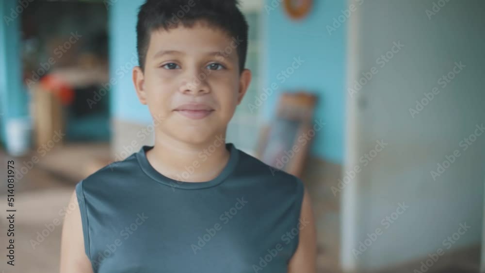 Latin boy walking to the camera smiling Latin boy walking to the camera smiling