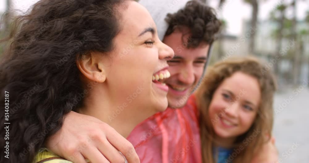 Cheerful young friends talking and having fun during their vacation