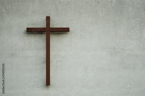 Brown cross on the wall of the church